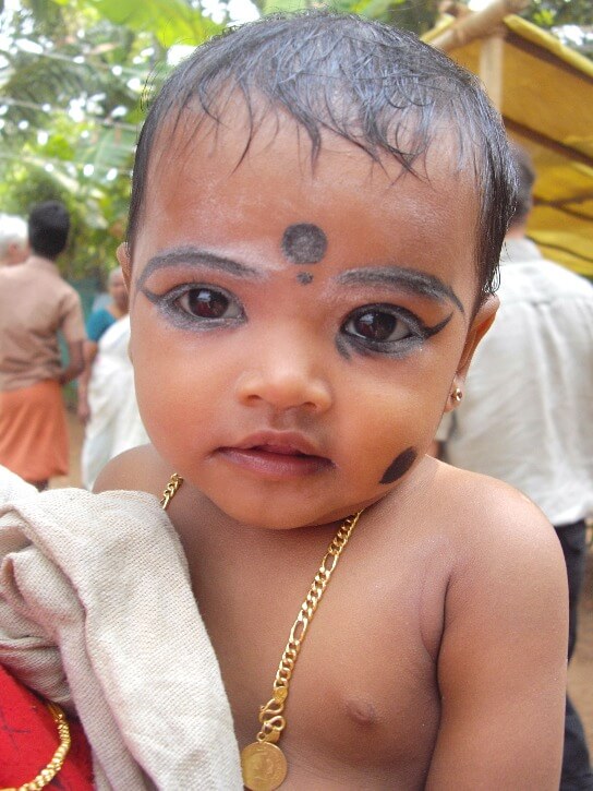 A cute Tamil baby in the backwaters of Alleppey in Kerala