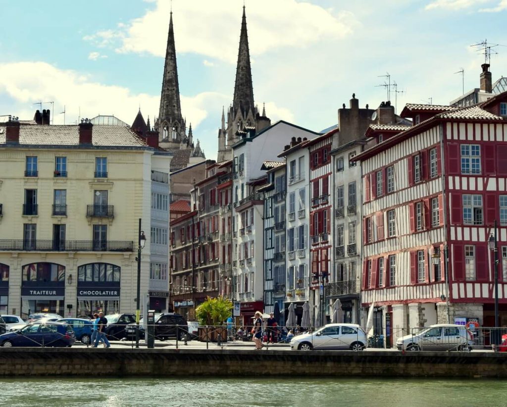 Visit the cathedral and the stilt houses around it from the opposite quay