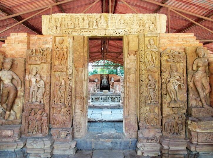 doorway decorated with Buddhist and natural scenes