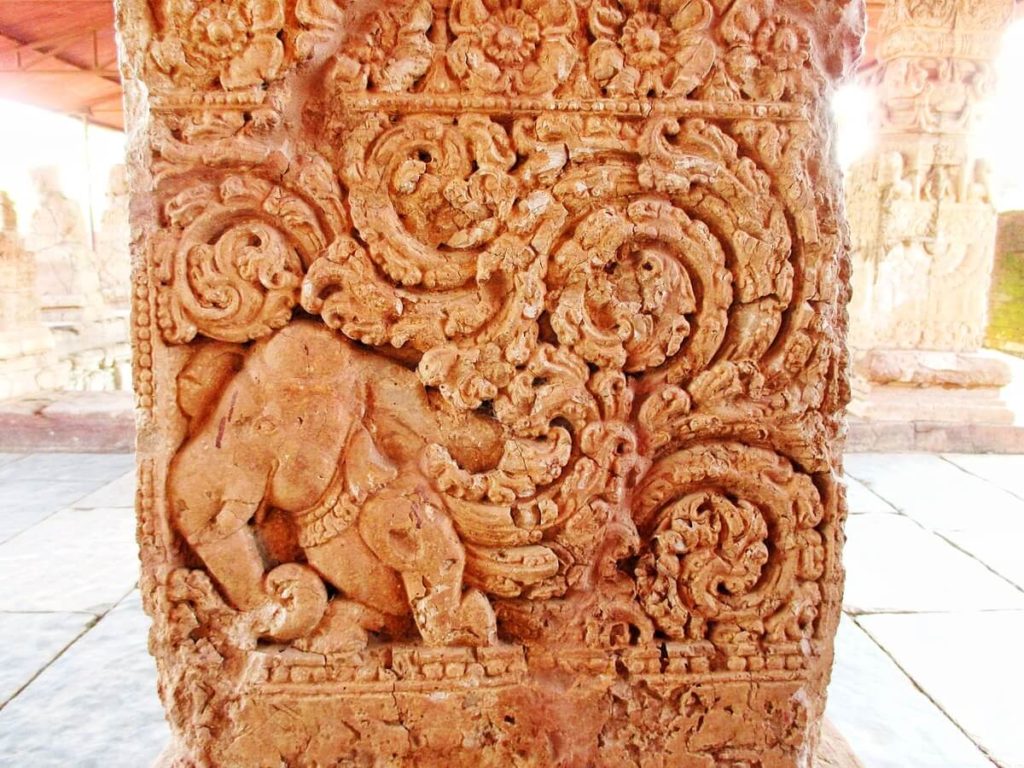 A pillar carved with a animal mixed of elephant and peacock