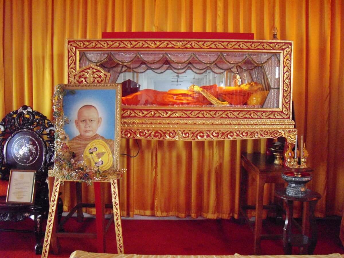Buddhist Thai funeral ceremony The body of the dead monk in the glass box