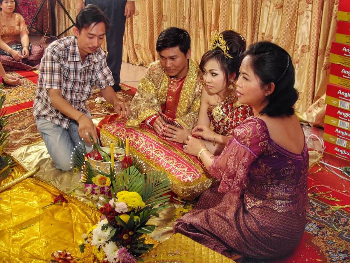 The groom, bride, Kak and his mother during the wedding rituals