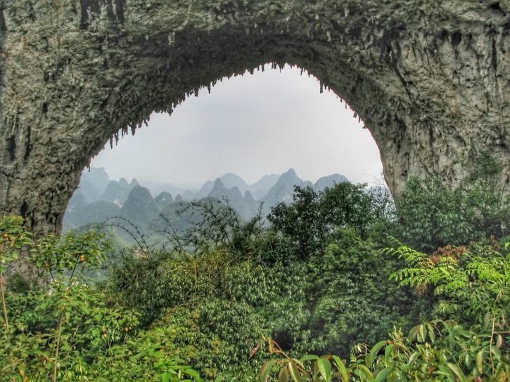 The arch of Moon Hill with the view of the karst peaks