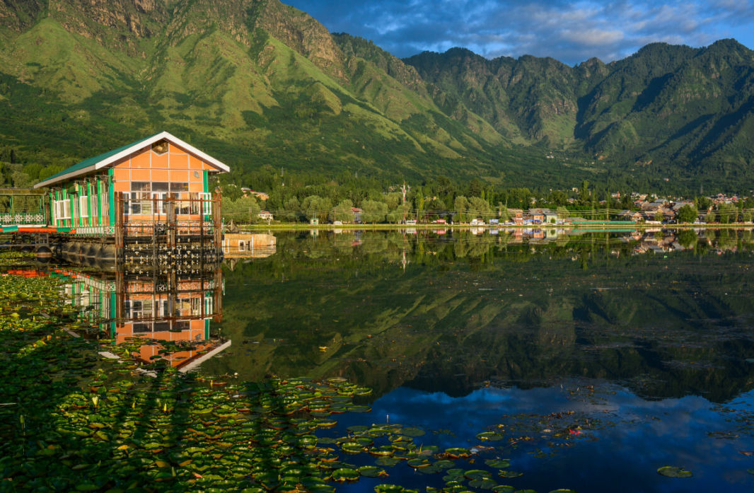 Houseboat pier with the mountains reflecting in Dal Lake