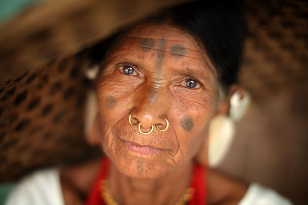 Face of a Sora Tribal woman with her facial ornaments and tattoo