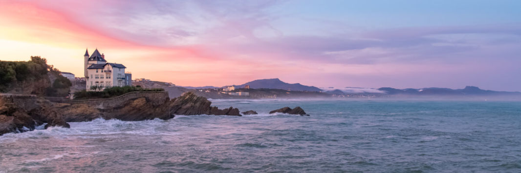 Biarritz sunset with Belza villa and Pyrenees mountains