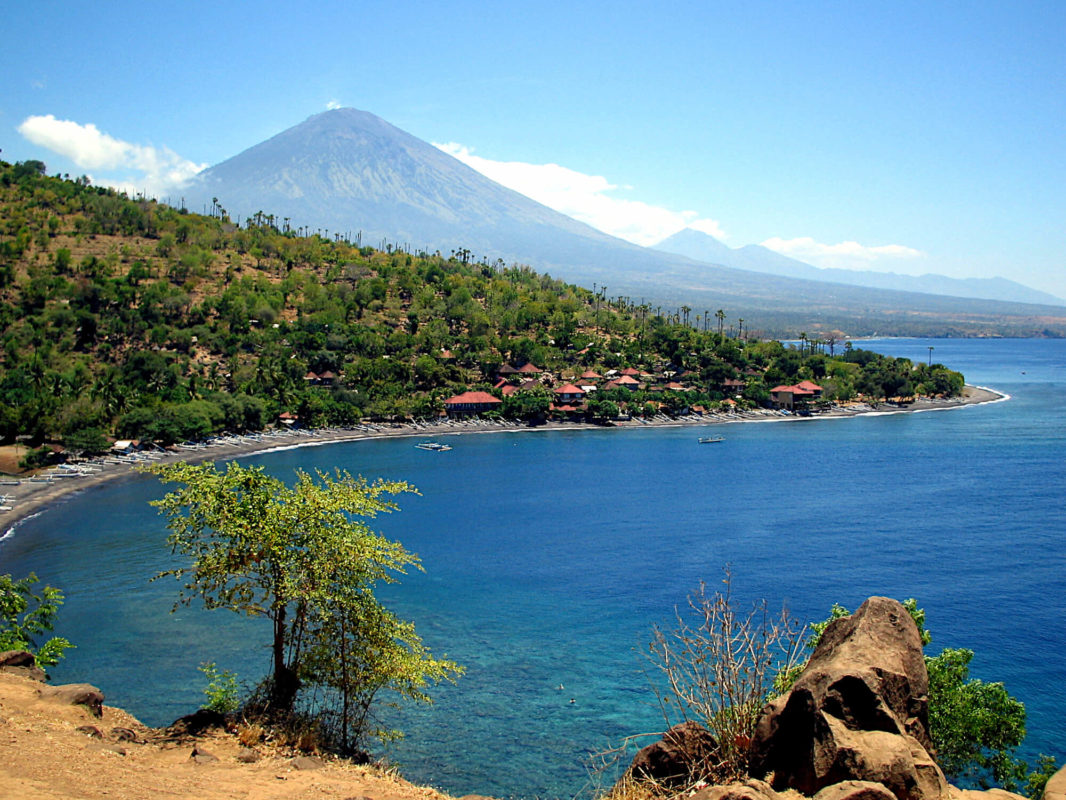 Batur volcano overlooking Amed jungle, beach and Bali sea