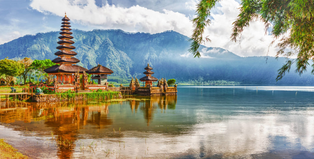 Balinese temple surrounded by the mountains and in the middle of Bratan lake