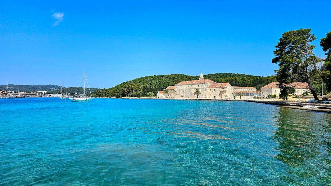 The blue pristine water of Badija island and its monastery